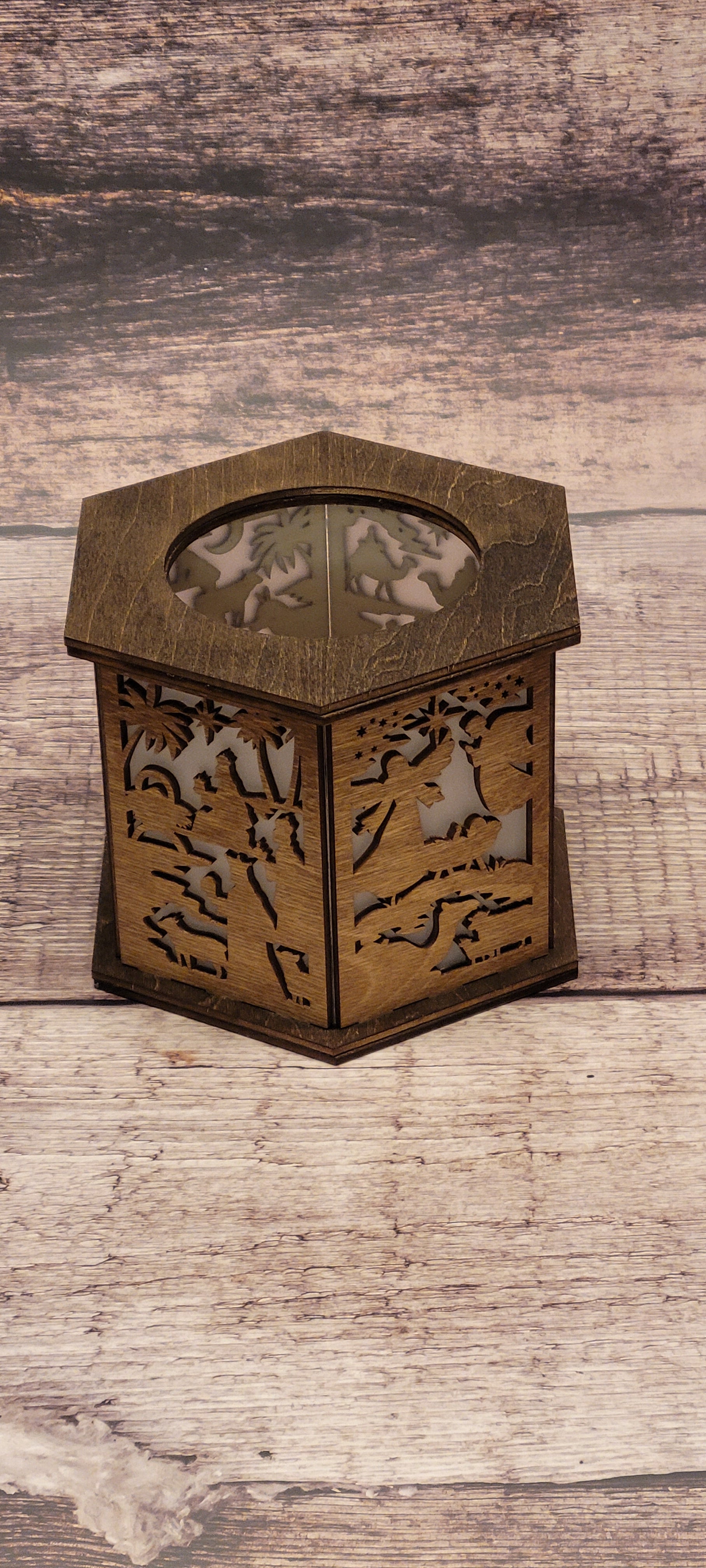 Front view of nativity scene Christmas lantern showing detailed laser-cut biblical imagery