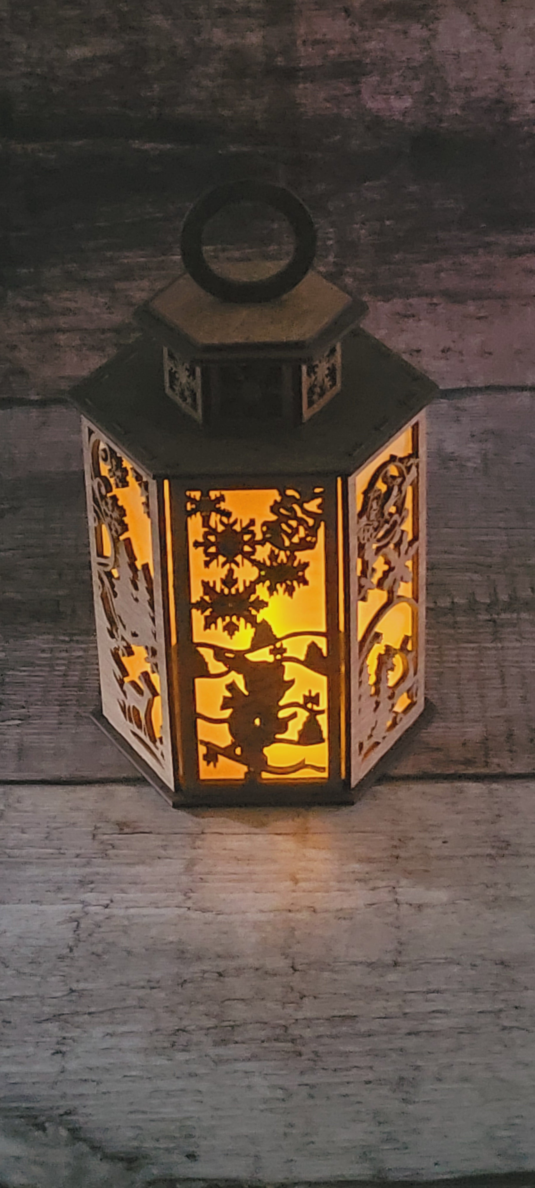 Tiered wood Christmas candle holder with winter scene displaying rustic-luxury finish and holiday charm