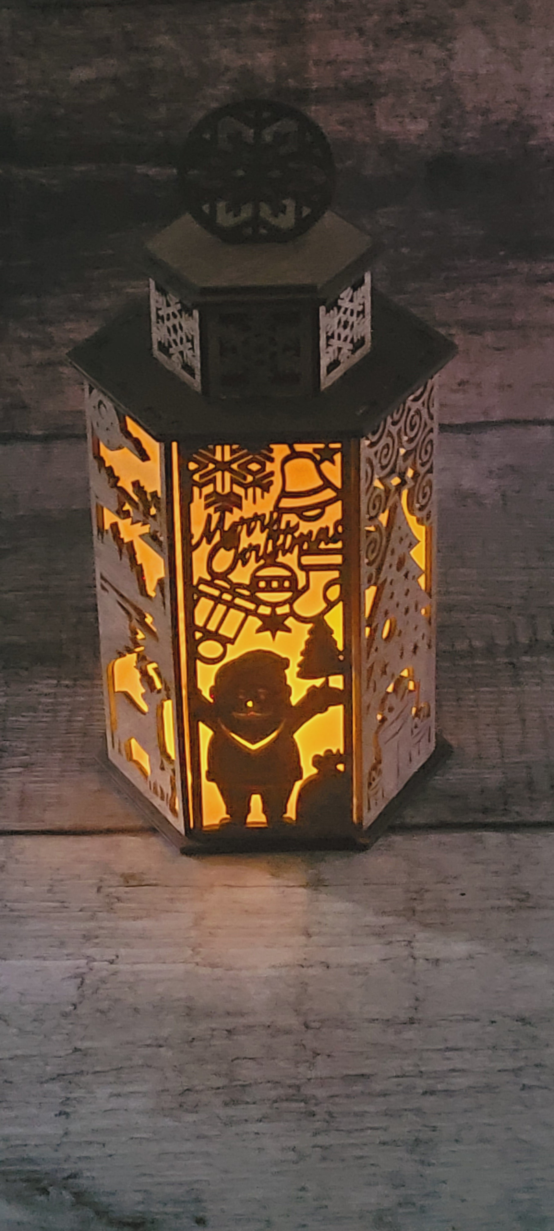Laser-cut Christmas lantern in sustainably sourced wood with snowflake handle and rustic-luxury finish
