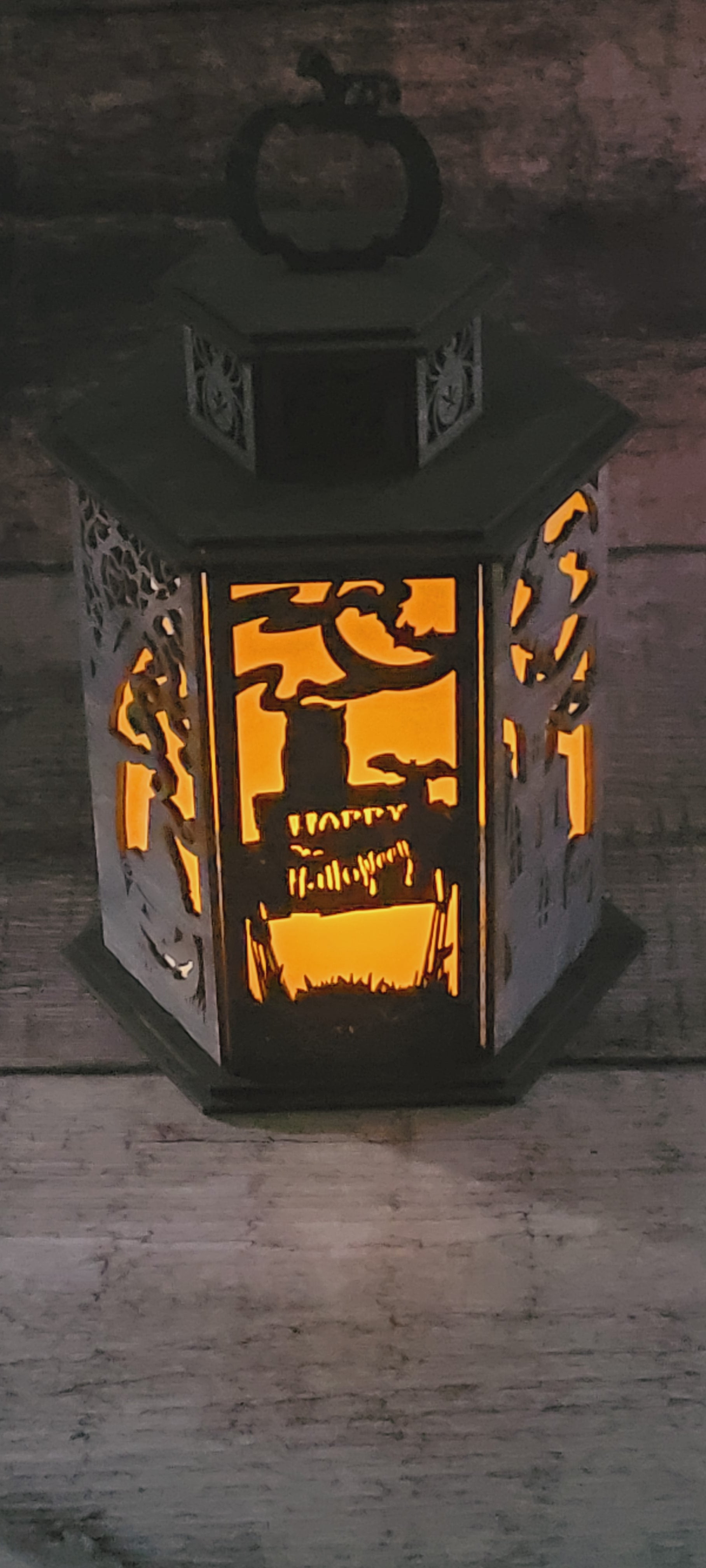 Laser-cut Halloween lantern in sustainably sourced wood with pumpkin handle and rustic-luxury finish
