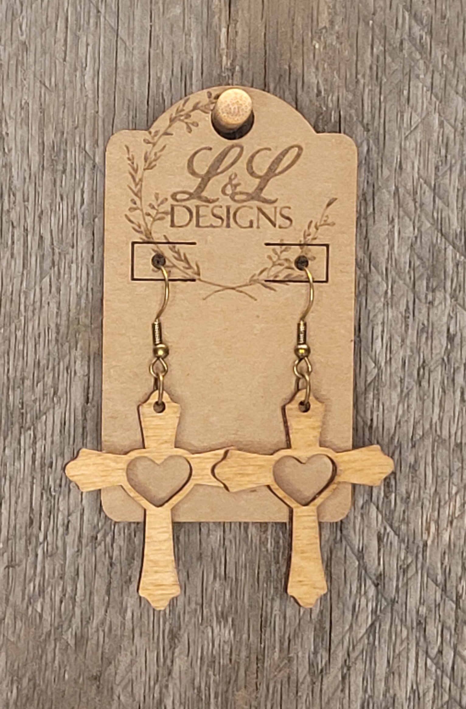 Wood cross earrings with heart cutout design in natural wood finish