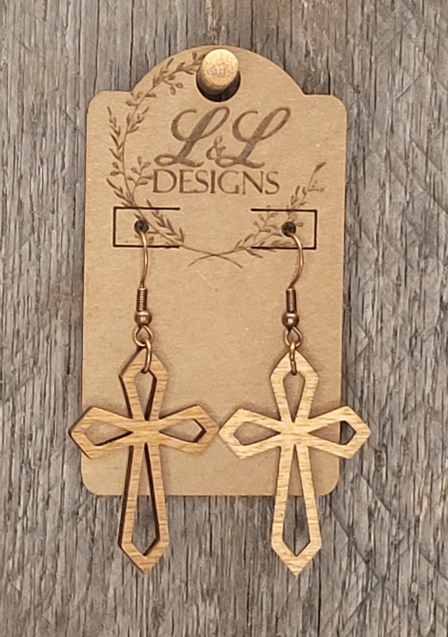 Cross earrings with open cutout design in laser-cut wood and natural finish"