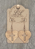 Solid wood heart earrings with cross cutout design displayed on L&L Designs branded card against weathered wood background.